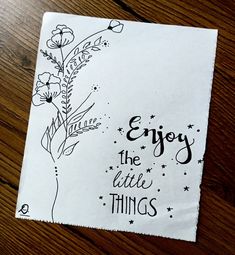 a piece of paper that says enjoy the little things