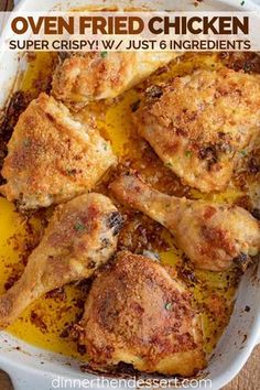 oven fried chicken in a casserole dish on a wooden table with text overlay that reads oven fried chicken super crispy / w / v / just 6 ingredients