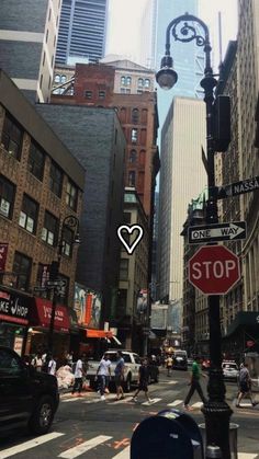 a city street filled with lots of tall buildings