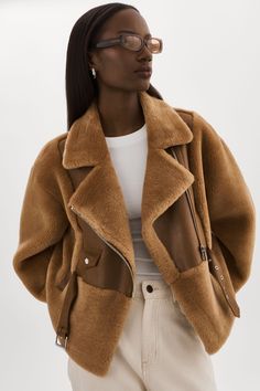 Our coziest-ever faux fur jacket is designed to keep you warm from the chalet to the city. Cut from our softest faux-fur for a loose fit, it features a notch collar with adjustable belt straps at the waist and sleeves so you can adjust the shape with plenty of pockets to keep things safe. Women In Their 30s, Ready For Autumn, Trending Colors, Chic Outfit Ideas, Capsule Wardrobe Essentials, Textured Knit Sweater, Coat Trends, Cozy Coats, Shearling Vest