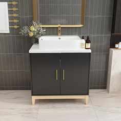 a bathroom sink sitting under a mirror next to a counter top with a vase on it