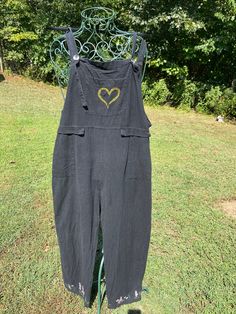 Upcycled linen overalls hand embroidered with a fern leaf heart on the front pocket and wildflowers along the bottom hem. Thank you for viewing! Casual Embroidered Cotton Overalls, Casual Cotton Embroidered Overalls, Womens Overalls, Linen Overalls, Fern Leaf, Overalls Women, Heart On, Fern, Front Pocket