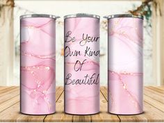 three pink tumbles with the words be your own kind of beautiful on them