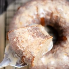 a close up of a doughnut on a fork