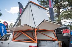 the back end of a truck with an awning on it