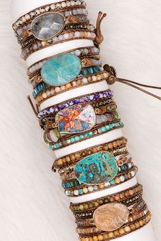 These gorgeous bracelets are made from long, brown leather strands that wrap around your wrist multiple times. Large stone charm accented with smaller stones and beads featuring a sunflower closure charm. Western Bracelets, Turquoise Wrap Bracelet, Stackable Necklaces, Aqua Stone, Treasure Jewelry, Boho Wrap Bracelet, Wrist Wrap, Creative Stuff, Wrap Bracelets