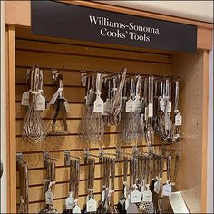 there are many different kinds of cooking utensils on display in the kitchen store