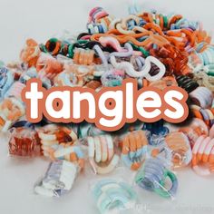 a pile of assorted plastic rings with the word tangles over it