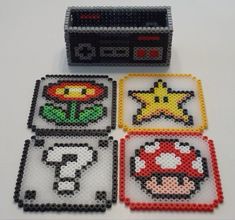 four different types of nintendo coasters made out of perler beads