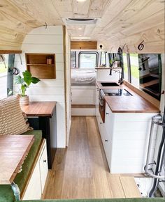 the interior of an rv with wood flooring