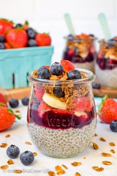 fruit and yogurt parfait in a jar with strawberries on the side