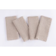 four pieces of linen with fray edges on a white background