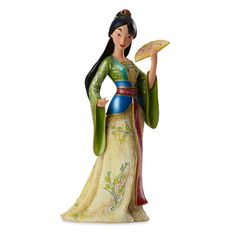 a figurine of a woman holding a fan