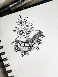 a drawing of a book with flowers on it