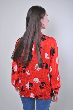 "Flowers print women retro red long sleeve blouse, Size XL Welcome to TARASCOMMON.ETSY.COM Unique clothing from the 20th century. Model tall - 170cm XL. Sleeve - 40cm / 15.74inch; ( armpit to end of sleeve); Width - 60cm / 23.62inch; Length - 65cm / 25.59inch. All measurements are taken seam to seam while lying flat. This item is vintage, so it can have some defects. Additional photos can be send We are glad that you are interested in lots that we sell. Wish you a good shopping! FOLLOW US : Inst Vintage All-over Print Top For Spring, Red Graphic Print Blouse For Fall, Red Long Sleeve Top With All Over Print, Vintage Printed V-neck Blouse, Vintage Long-sleeve Printed Tops, Vintage Long Sleeve Printed Tops, Vintage Printed Long Sleeve Tops, Vintage Long Sleeve Top With Graphic Print, Red Vintage Print Top For Spring