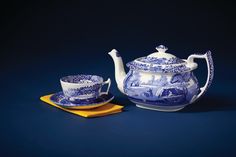 a blue and white tea set with matching saucers