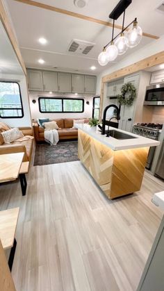 a kitchen and living room in an rv