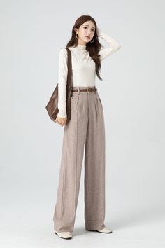 With its timeless silhouette and luxurious feel, this womens bespoke high waist wide leg wool pants is a true investment piece that will elevate any outfit to new levels of refinement and class. DETAIL * 30% wool, 30% fiber, 40% polyester * Fully satiny lining, more nice to the touch body * Two side seam pockets * Front button and zipper closure * Maxi wool pants * Wide leg wool pants * Loose wool pants * Daily casual pants * For autumn and winter * Dry clean * Belt not for sale * Lean More about the items From the FAQs on the page bottom MODEL SIZE Bust 85 cm(33.4") Waist 67 cm(26.7") Height 168cm (5' 6") She wears size XS Choose CUSTOM Order if you * Need a better fit * Can't find your size in our size Chart * Change the Style * Chang the Length * Your Height is not Between 5'1" - 5"9" * Formal High-waisted Winter Pants, Tailored Wide Leg Dress Pants For Winter, Solid Winter Dress Pants For Office, Winter Office Dress Pants In Solid Color, Winter Office Dress Pants Full Length, Solid Winter Office Dress Pants, Winter High Waist Formal Pants, Winter Full-length Dress Pants For Office, High Waist Formal Pants For Winter