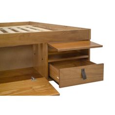 a wooden bed with drawers underneath it on a white background and an open drawer under the bed