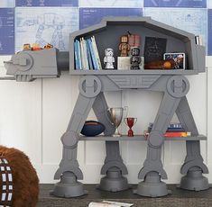 a star wars themed shelf with books and toys