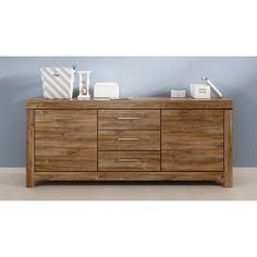 the sideboard is made from wood and has drawers