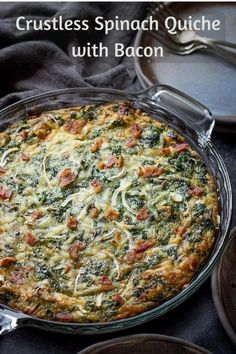 a quiche with bacon and spinach in a glass dish on a black table