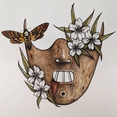 a drawing of a face with flowers and moths on it