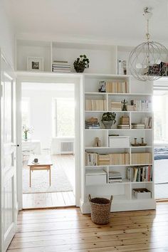 a room with white walls and wooden floors