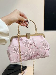 Elevate your style with our Chic Pink Lace Embroidery Shoulder Bag. Perfect for parties, weddings, and special occasions, this bag adds a touch of elegance to any outfit. The intricate lace embroidery and versatile shoulder strap make it both fashionable and functional. Get ready to turn heads with this must-have accessory. Color : Pink Bag Size : Small Pattern Type : Plants Type : Kiss Lock Bag Composition : 100% Polyester Material : Polyester Bag Height Bag Length Bag Width 15 23 8 Vintage Pink Bags For Weddings, Floral Embroidered Pouch Shoulder Bag For Wedding, Vintage Pink Bags For Wedding, Elegant Floral Embroidered Shoulder Bag For Parties, Elegant Shoulder Bag With Floral Embroidery, Vintage Embroidered Bags For Events, Handheld Floral Embroidery Shoulder Bag For Wedding, Wedding Pouch Bag With Floral Embroidery, Handheld Embroidered Bag For Weddings