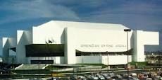 cars are parked in front of a large white building with the words granan bay fine spa on it