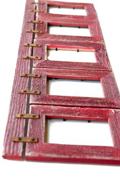 an old red wooden ladder with metal handles