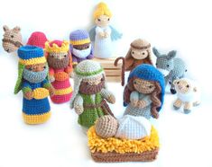 crocheted nativity figurines displayed on white surface