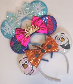 the headbands are decorated with colorful sequins and cartoon character hair clips