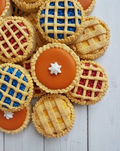 some cookies are decorated with red, white and blue icing on top of each other