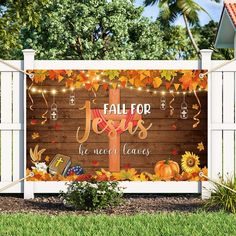 a fall for jesus sign in front of a white fence with autumn leaves on it