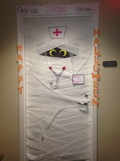 this door is decorated to look like a doctor's hat and stethoscope