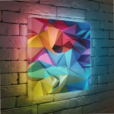 an abstract painting on a brick wall with light coming through the window and colorful shapes