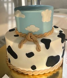 a cake decorated with black and white polka dots