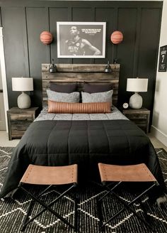 a bedroom with a bed, nightstands and pictures on the wall