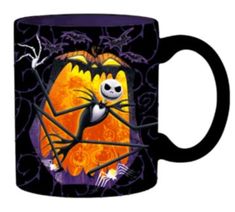 a black coffee mug with an image of a jack - o'- lantern on it