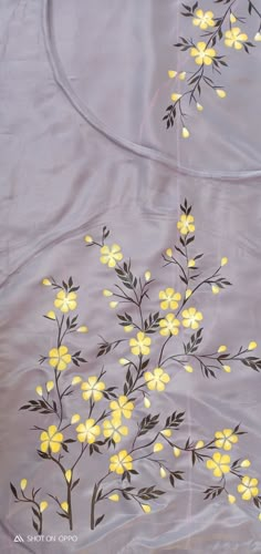 yellow flowers are painted on the fabric