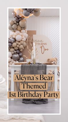 the birthday party is set up with balloons and decorations, including an arch that reads alyna's bear themed 1st birthday party