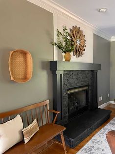 a living room filled with furniture and a fire place next to a wall mounted clock