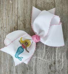 This is for 1 Embroidered Mermaid Hairbow.  Any ribbon or thread color changes need to be added in the personalization section. pictured is white/pink moonstitch ribbon. Embroidered Mermaid, Small Hair Bows, Large Hair Bows, Mermaid Painting, Stretch Headband, Boutique Hair Bows, Girl Hair Bows, Barrettes, Grosgrain Ribbon