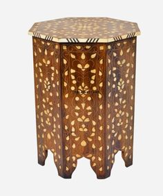 a wooden table with an intricate design on it