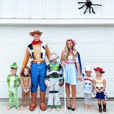 the family is dressed up as toy story characters