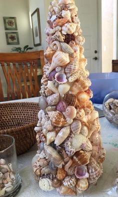 a christmas tree made out of seashells on a table