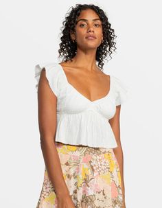 Roxy Brisa Flutter Sleeve Crop Top. Featuring A Peplum Hem To Flatter Your Shape, Roxy's Brisa Crop Top Is Made Of Breezy Cotton Gauze Fabric With A V-Neck And Flutter Sleeves For A Feminine Touch. Easy Fit. Pull On Closure. Beachy Raw Edge Detailing On Sleeves And Hem. Encased Elastic On Neckline. Under Bust For Easy Pull On Fit. 100% Cotton. Machine Wash. Imported. Fitted Ruffle Sleeve Summer Tops, Fitted Summer Tops With Ruffle Sleeves, Flowy Ruffled Flirty Tops, Flirty Flowy Ruffled Tops, Summer Flutter Sleeve Top With Ruffles, Beach Fitted Top With Ruffle Sleeves, Fitted Beach Top With Ruffle Sleeves, Beach Tops With Ruffles And Flutter Sleeves, Feminine Ruffled Tops For Vacation