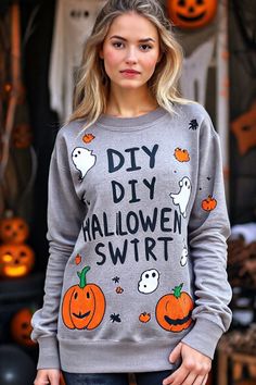 a woman standing in front of pumpkins with the words diy diy halloween sweater on