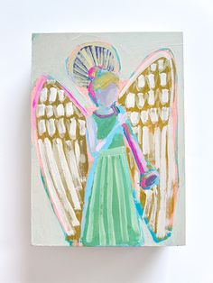 an angel painting on a white wall with pink and blue wings, holding a ball